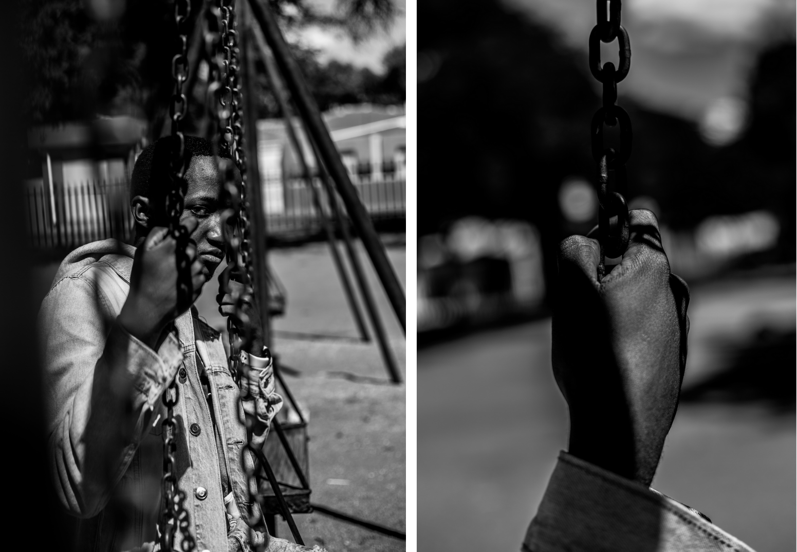 Young man sits alone on a swing, his hand gripping the chains either side of his face