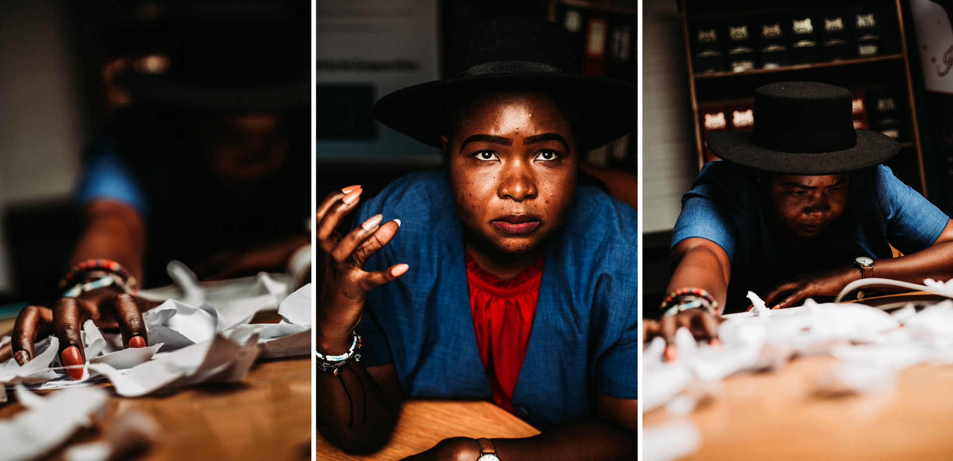 Triptych of images shows young woman wearing blue coat and white hat leaning over a table of ripped paper, her hand clutching the table